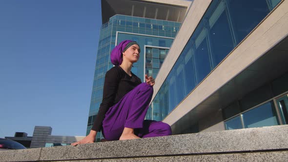 Bottom View Muslim Young Girl Islamic Pensive Woman Wearing Hijab and Purple Pants Barefoot Female