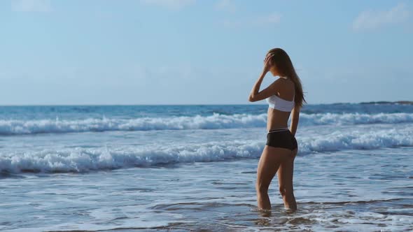 Young Woman Going To Snorkel in Clear Sea