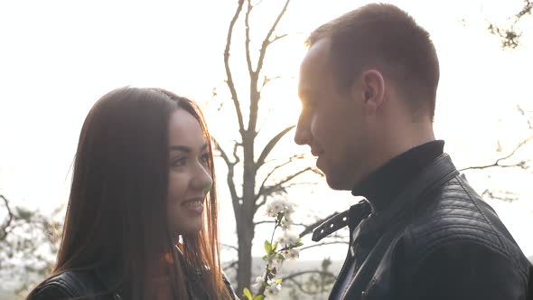 Loving Young Couple Kissing in the Park They are Happy Together