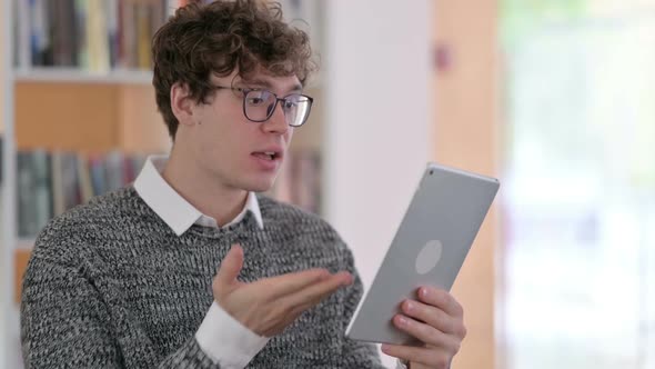 Portrait of Video Call on Tablet By Young Man