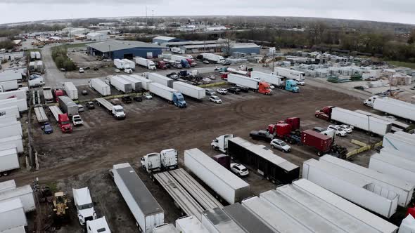 Aerial Drone View of Truck Repair Shop Service Building and Many Trucks Near It USA