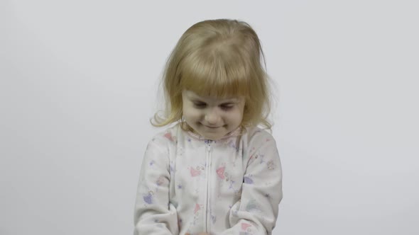 Kid Playing with Hand Made Toy Slime. Child Having Fun Making Pink Slime