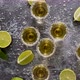 Top View of Golden Tequila Shots Served with Lime and Sea Salt on Table - VideoHive Item for Sale