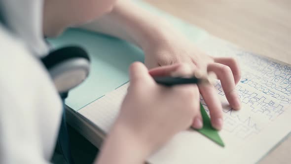 Close Up: Schoolboy Doing Homework.