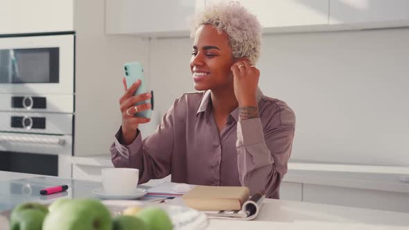 Young African American Woman Answer Video Call on Phone Smile Wave Hand Hello