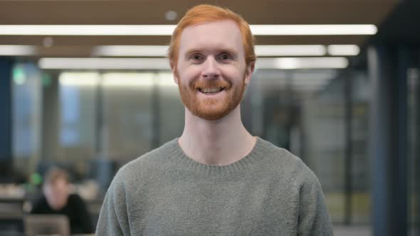 Portrait of Attractive Young Man Smiling at Camera