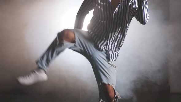 Young Caucasian Man Wearing T-shirt and Jeans Show Various Steps of Dance