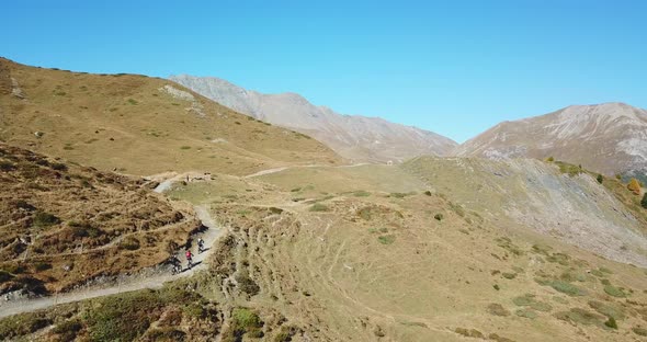 Aerial drone view of a group of mountain bikers on a singletrack trail