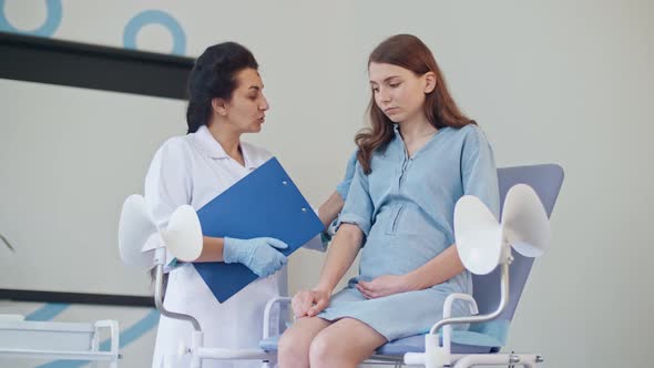 Teenager Pregnant Feeling Sad Empathy While Visit Gynecologist Doctor at the Medical Clinic.