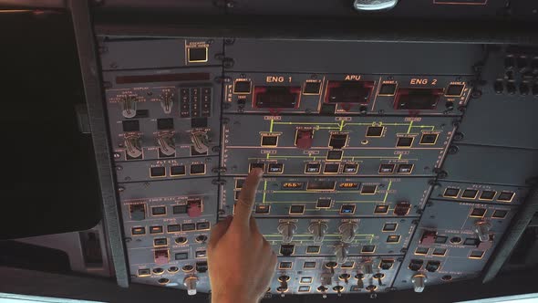 The cockpit of the aircraft. The pilot checks the electronics of the aircraft