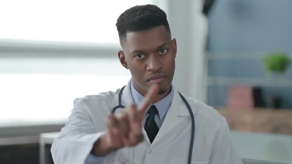 Portrait of African Doctor Showing No Sign by Finger, Denial