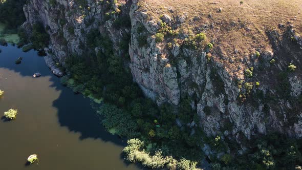 Beautiful Rocky Mountain Climbing Wall at the Bank of the River