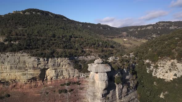 Aerial view of dangerous sheer drop projecting cliff in natural area