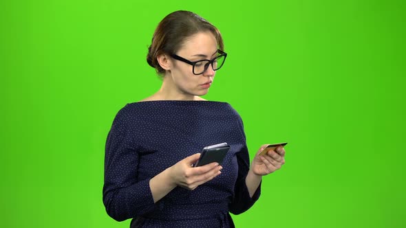 Teacher Transfers Money To the Card Using the Phone. Green Screen