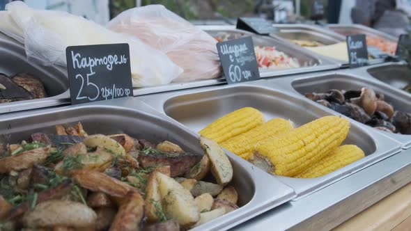 Various Street Food Is Sale on Display Case at Festival. Street Market on Party