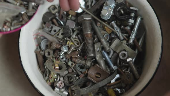 Lots of Different Screws Bolts Grommets and Fasteners Old and Used in Metal Bowl