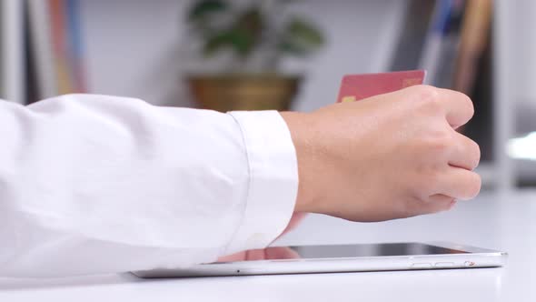 Woman Using Laptop for on Line Purchase with Credit Card. Close Up