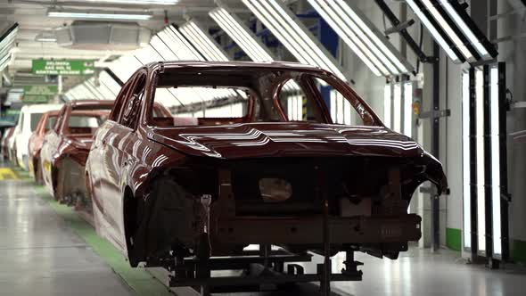 Car Manufacturing on the Production Line in the Factory 4K