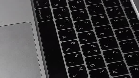 Closeup of a Silver Laptop Keyboard