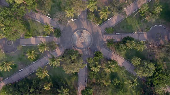 Top View Of Ornamental Fountain At The Center Of Garden With Tree Palms In Jardín Núñez, Colima Mexi