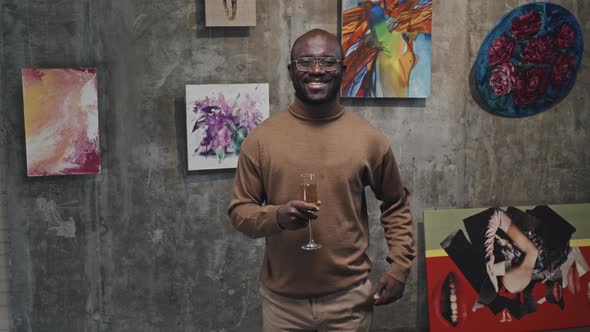 Visitor with Champagne Glass in Gallery