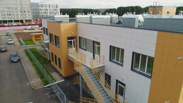 Colorful Kindergarten Building with Emergency Ladder in City