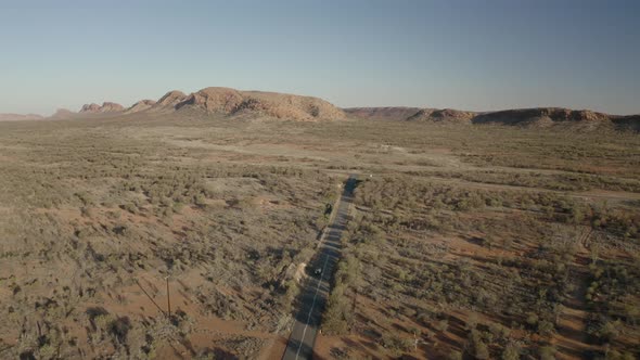 Aerial view of x travelling in the outback.