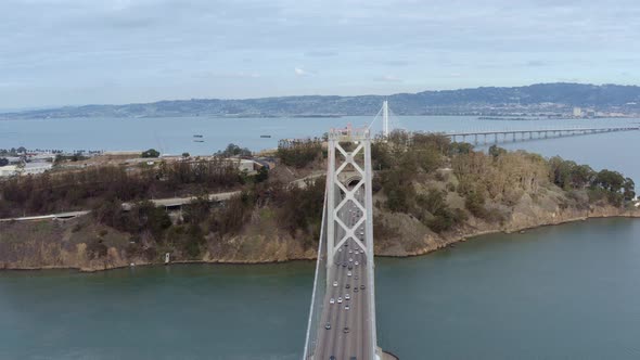 Aerial: cars crossing the bridge, drone view