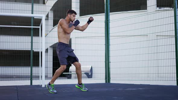 Fight with Shadow Naked Torso Man Doing Workout