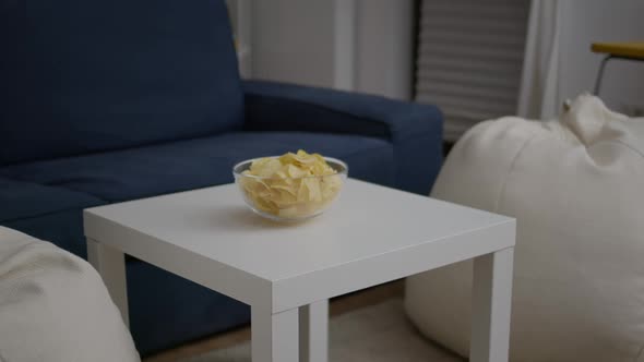 Closeup of Junk Fried Potato Bowl Put on Woden Table in Empty Party Room