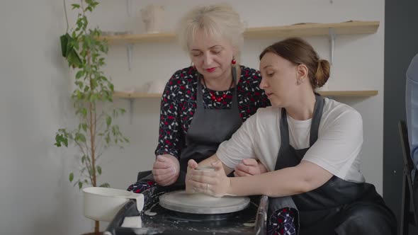 A Female Master Shares Her Skills While Giving a Lesson for the Elderly