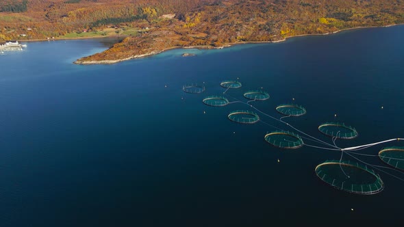 High altitude view of salmon farming operation in scenic arctic circle