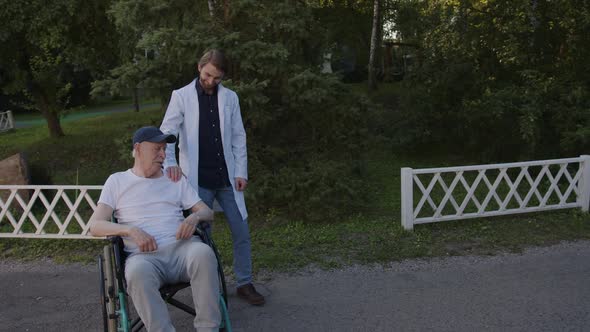 Doctor Support His Old Man in Wheelchair