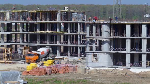 Large Construction Site with Buildings Under Construction and Multistorey Residential Homes