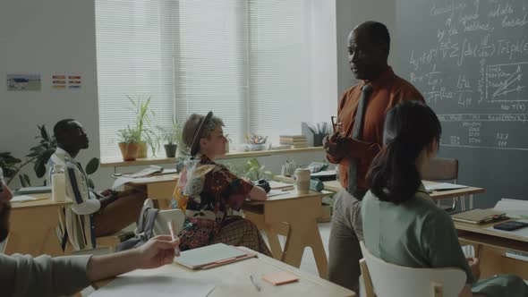 African American Professor Giving Lecture in High School