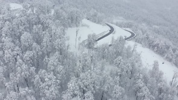 Aerial Fpv Drone View Serpentine Road Traffic Transportation Under Funicular at Winter Ski Resort