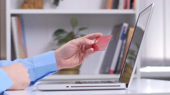 Man Making Online Shopping with Laptop. Close Up