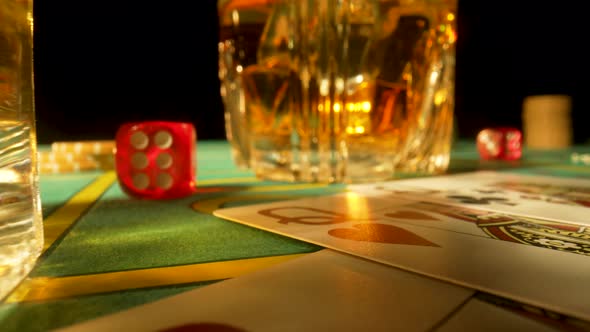 Gaming Table in a Casino with Glasses of Whiskey and Set of Three Ladies