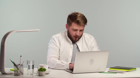 Young Man Student Freelance Using Laptop Working From Home Office