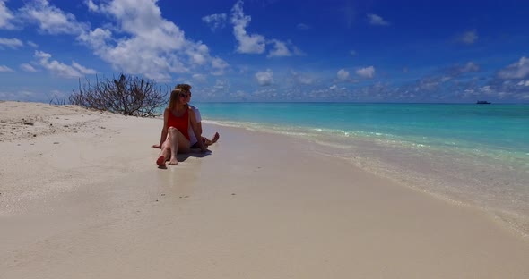 Fun lady and man in love dating on vacation enjoy life on beach on summer white sandy 4K background