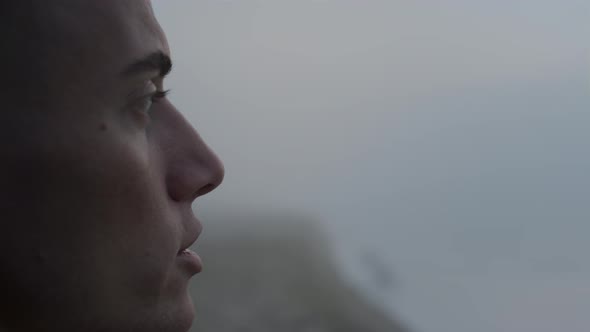 Dreamy Man Enjoying Ocean Landscape at Sunrise