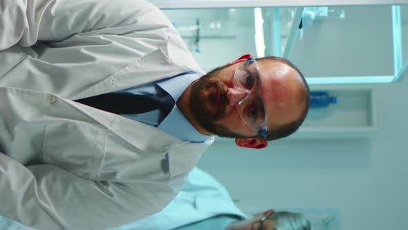 Vertical Video Portrait of Exhausted Chemist Looking at Camera