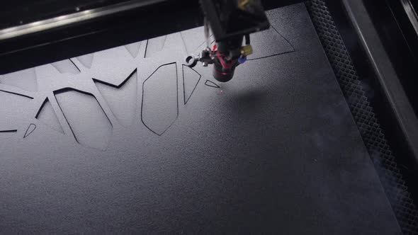 Industrial Laser is Cutting a Pattern on a Plastic