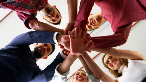 Group of business people forming a hand stack