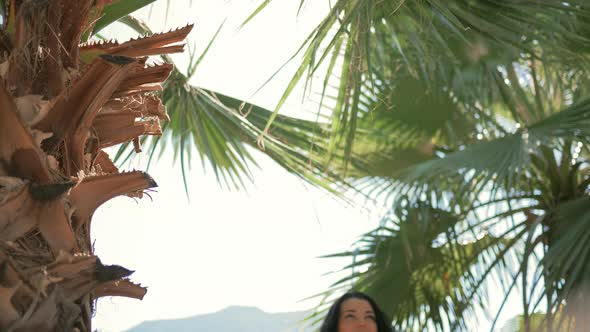 Beautiful Girl Walking in Tropical Forest.