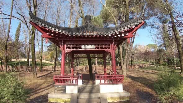 Beautiful red Chinese pavilion at the Artificial Lake national park, Tirana, Albania