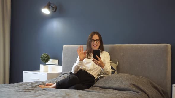 Portrait of a Beautiful European Woman Using Phone Girl Chatting with a Friend Through a Video Call