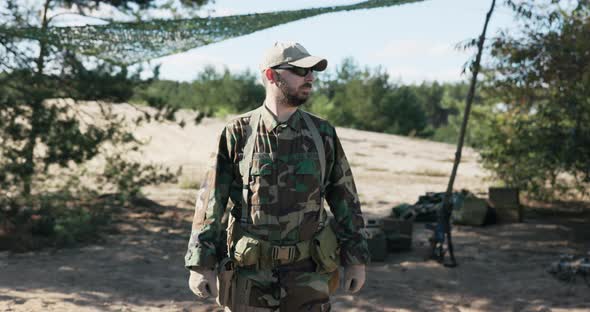 Soldier Military Territorial Defense Team Man Dressed in Moro Clothes Black Glasses Stands Against