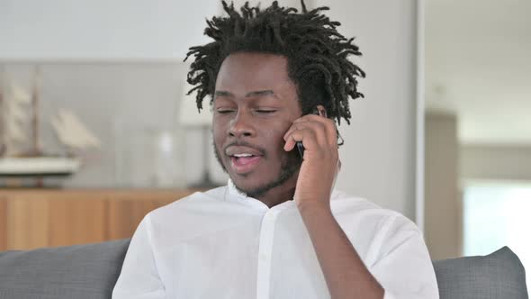 Portrait of African Man Talking on Smartphone 