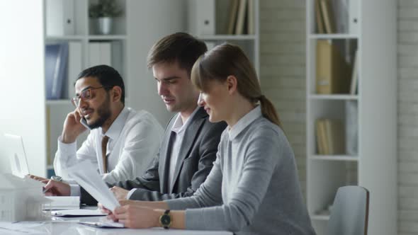 Business People Working in Architectural Office